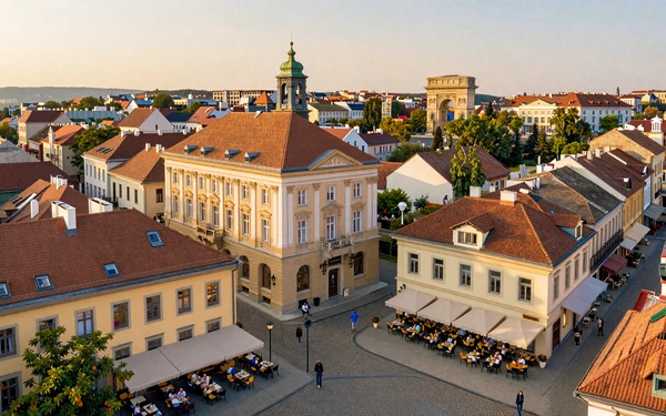 Bucharest old town with historic architecture and outdoor cafes at golden hour